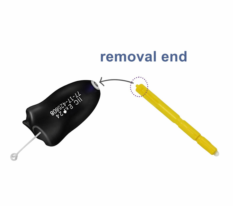 Removing old Starkey Hear Clear wax filter with removal tool